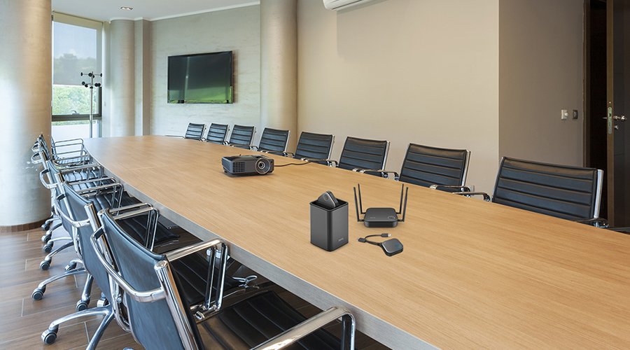A conference room with BenQ InstaShow wireless presentation system on the table 
