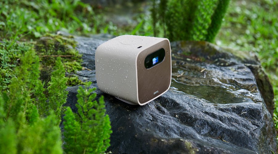An outdoor portable projector on the rock in the rain 