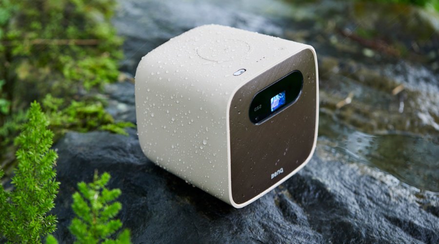 An outdoor portable projector in the street under the rain